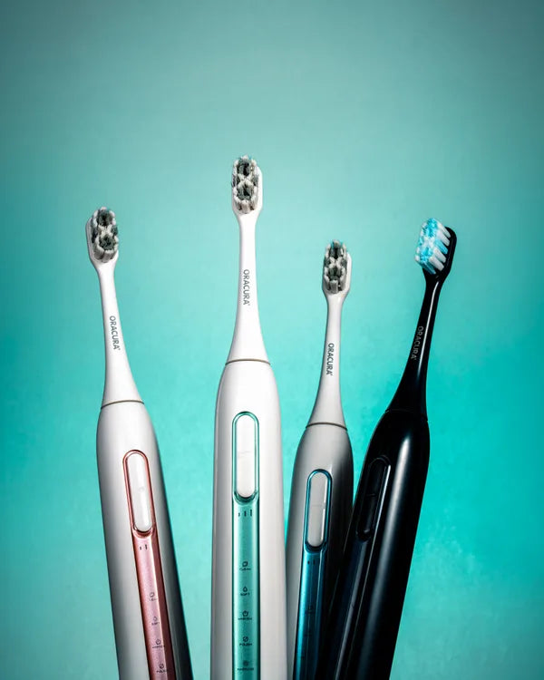 An ORACURA customer with their water flosser or electric toothbrush
