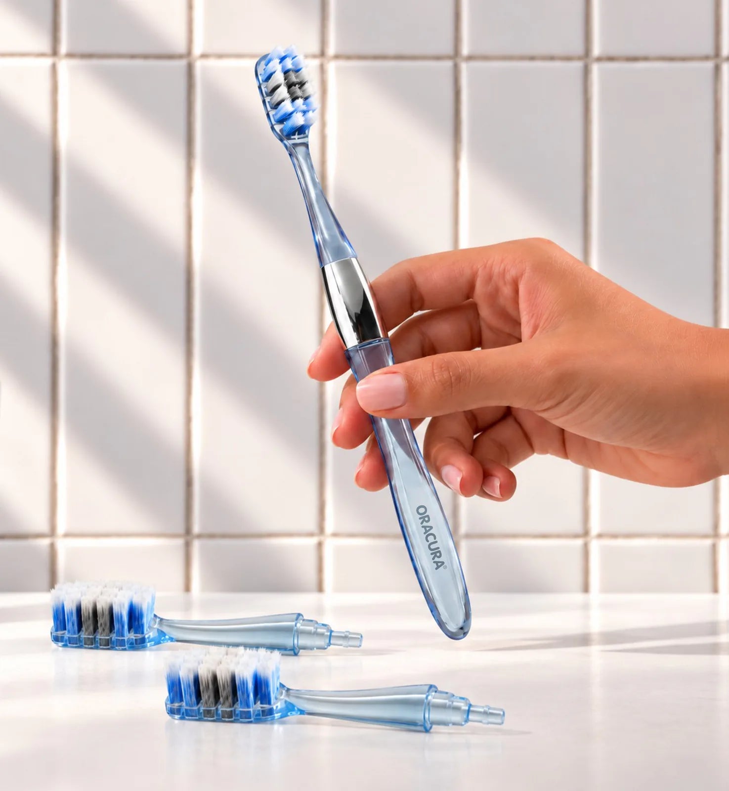 MB100 Replaceable Brushheads Manual Toothbrush – Blue – In use, with two spare brush heads