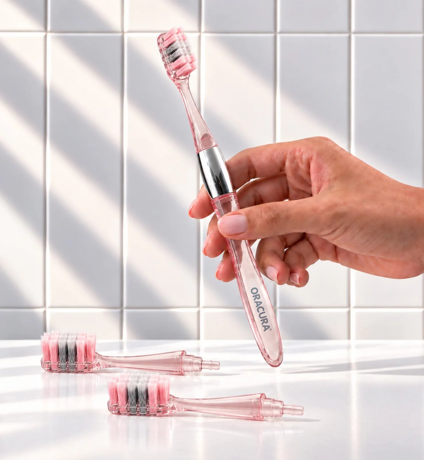 MB100 Replaceable Brushheads Manual Toothbrush – Peach – In use, with two spare brush heads